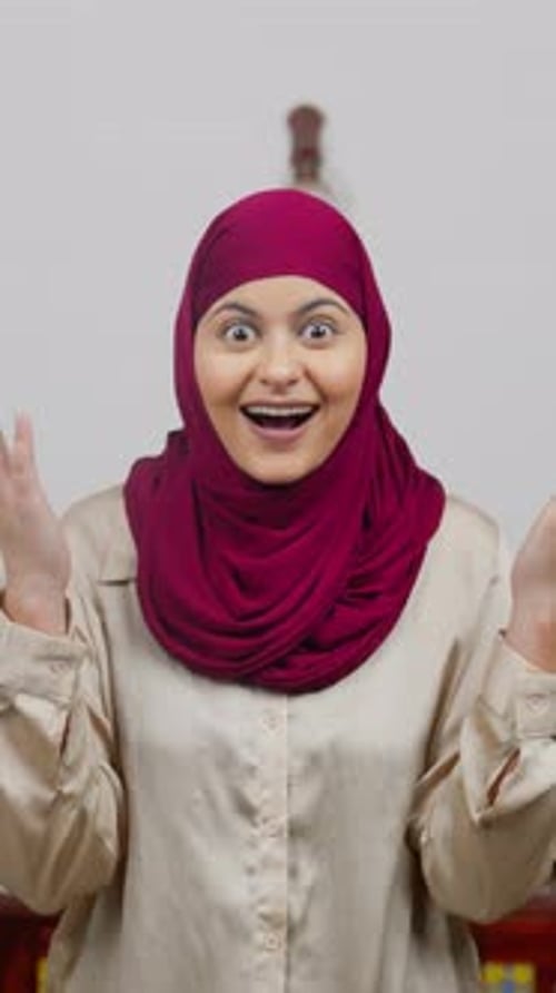Vertical Video of Surprised Muslim Woman in Hijab Scarf
