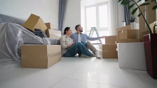 Happy Couple Planning Home Renovation and Design Together