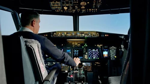 pilot pressing the gas pedal in the cockpit of a jet plane during a flight or flight simulator