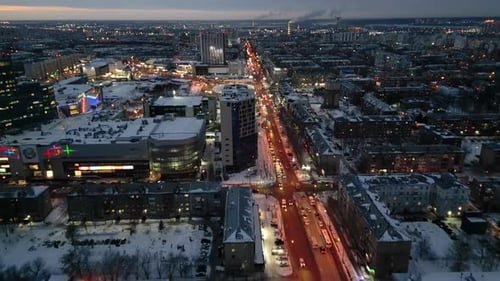 Aerial view of city at night in winter. Snow covered city at night.