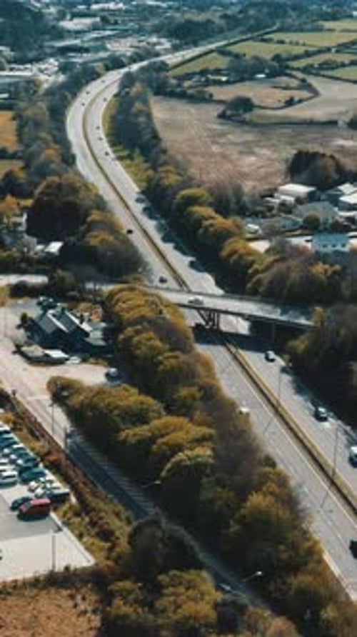 Cars are moving on the highway.Parking with many different vehicles Vertical video