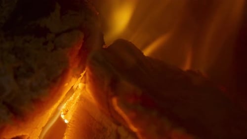 Close Up of Golden Fire Burning Wood