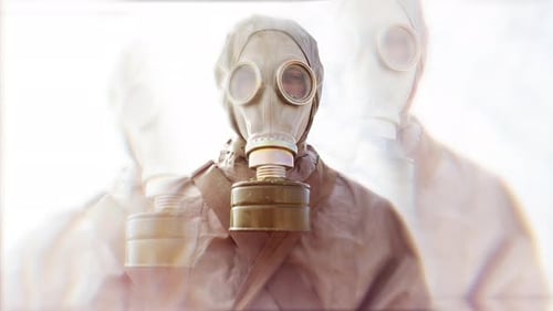 Man Wearing Gasmask and Suit Outdoors