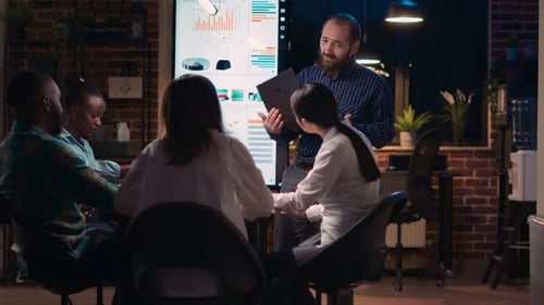 Corporate Meeting Presentation in Modern Office at Night