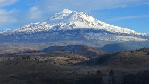Cinematic Aerial View of Mount Shasta Snow Covered Volcanic Peak in California