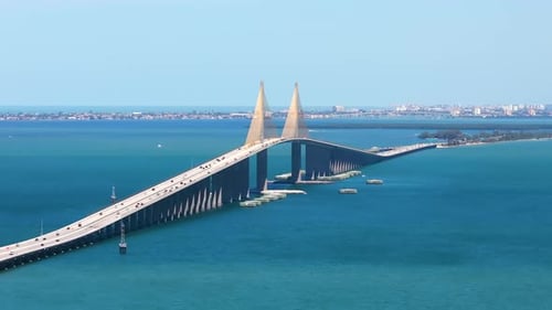 Aerial View of Sunshine Skyway Bridge Over Tampa Bay in Florida with Moving Traffic Concept of