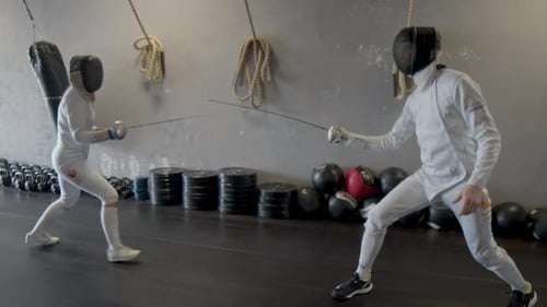 Professional fencers having a short duel
