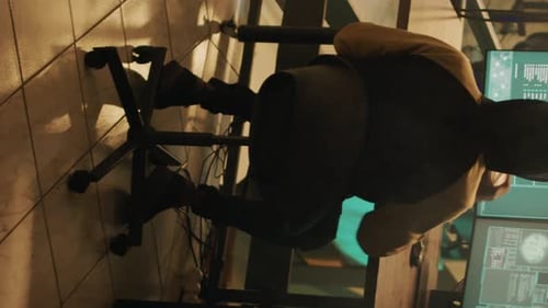 Vertical Video Silhouette of Hacker Coding Encryption to Plant Trojan Virus