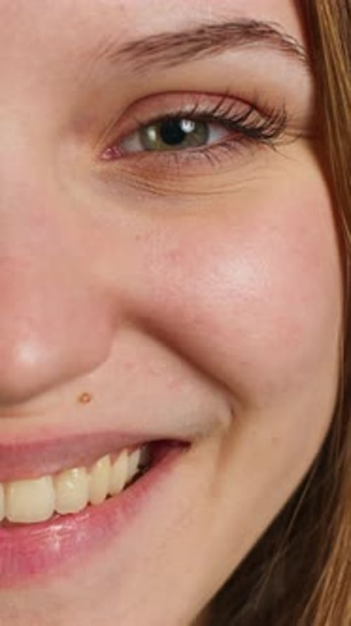 Vertical Video Extreme Close Up Shot of Cheerful Joyous Girl Smiling