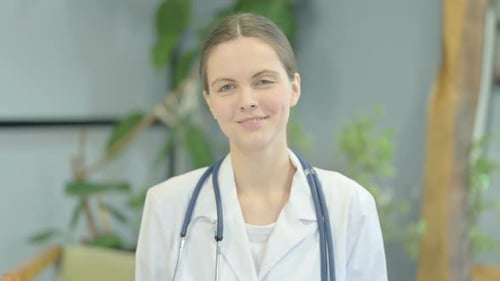 Smiling Doctor in White Coat with Stethoscope Portrait