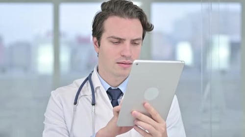 Doctor Using Tablet Computer in Modern Hospital