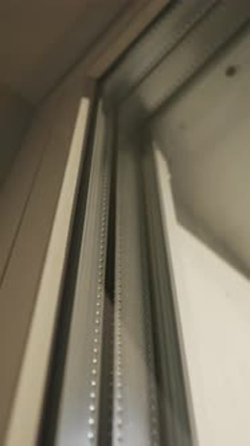 Close Up Detail of Double Pane Window Glass and Spacer Bar