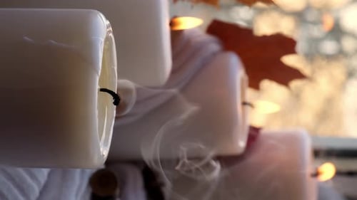 Candles Extinguished with Smoke Rising From Wicks