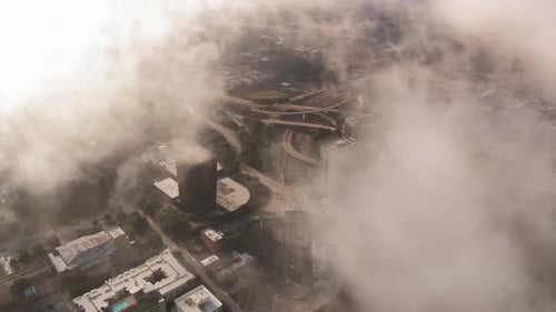 Top View of a City captured from Airplane in midst of Clouds