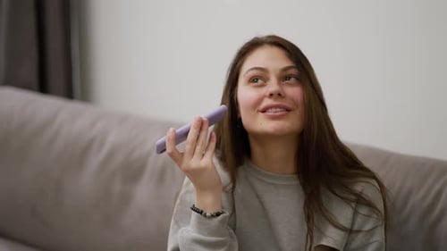 Woman Talking on Cell Phone at Home