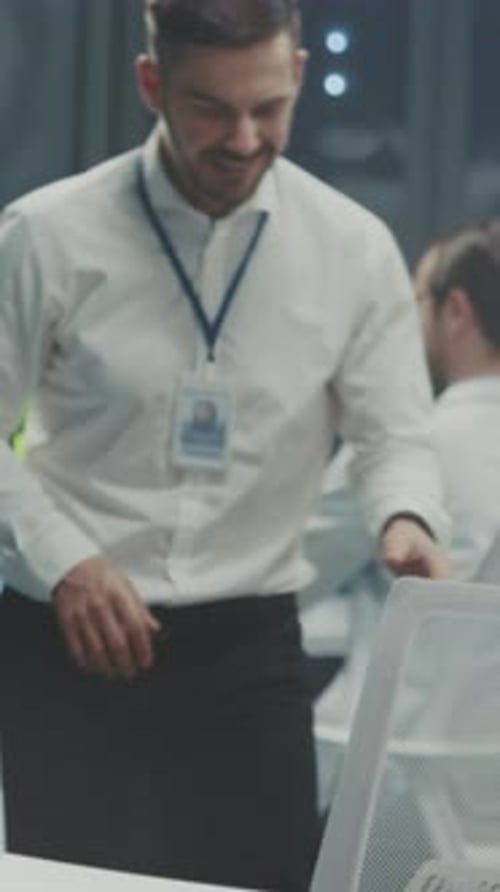 Man Working At Computer in Modern Dark Office