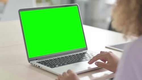 Close Up of African Woman Using Laptop with Chroma Key Screen