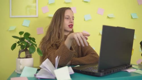 Woman Talking on Laptop During Video Call