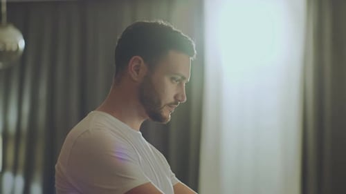 Man Working on Laptop at Home