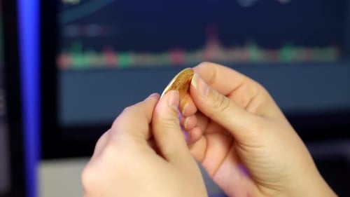 Hands Rotate Gold Bitcoin Coin Close Up