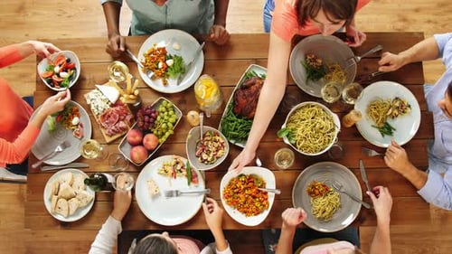 Friends Sharing Meal at a Dinner Party