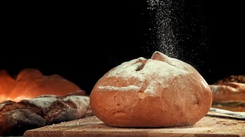 Flour Falls on Fresh Bread Filmed on a Highspeed Camera at 1000 Fps