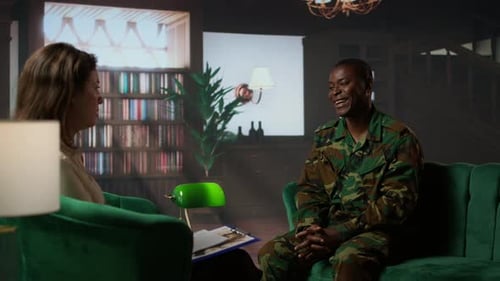 Man in Uniform Speaks with Counselor in Office