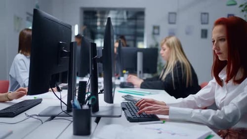 Panoramic Shot In Office Of WebDesign Company Young Adult Women Working With Computers