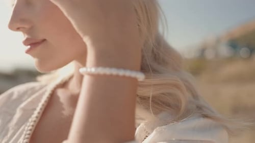 Elegant Woman Posing at the Beach on Sunny Day