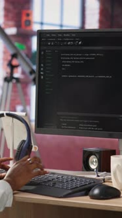 Developer Coding at Desk on Computer