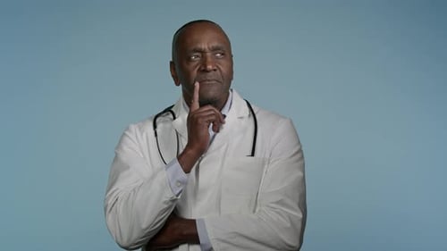 Pensive Thoughtful African American Man Professional Medic Male Doctor Healthcare Worker Wear White