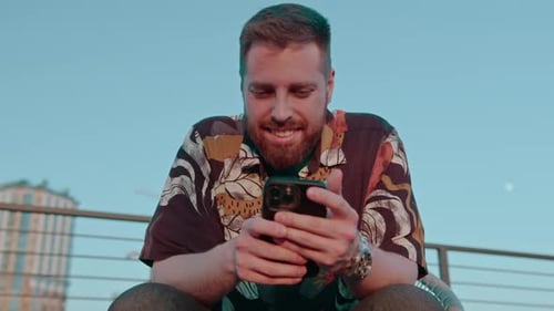 close-up of male hands holding a smartphone texting via messenger online communication
