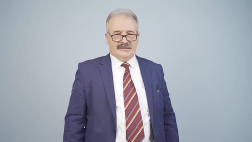 Man in Suit Thinking and Arms Crossed