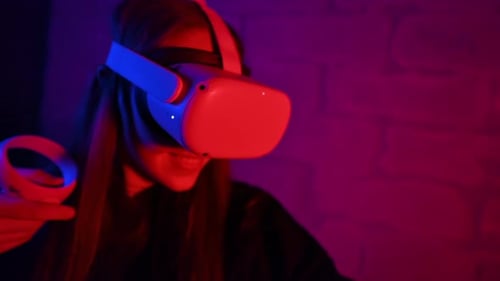 Woman Using Virtual Reality Headset Indoors
