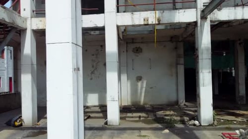 showcasing collapsed ceilings and twisted metal beams.. Roll right and pitch forward.
