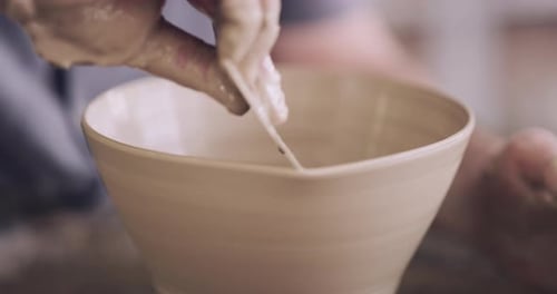 4k video footage of an unrecognizable man working with clay in a pottery studio