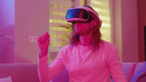 Man Wearing VR Headset Using Hand Gestures at Home