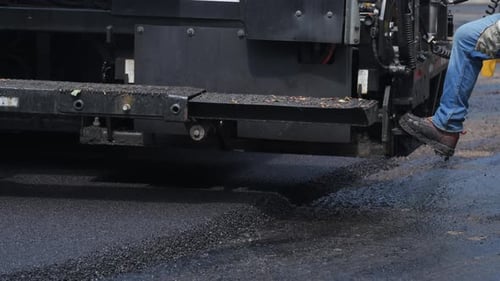 Element of Roadwork Development New Asphalt Road at Suburban Element of Asphalt Paver Work Close Up