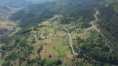Aerial View Of Mountain Village Among Forests
