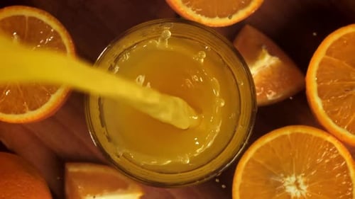 Orange Juice Being Poured into a Glass