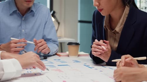 Team Discussing Data at a Corporate Meeting