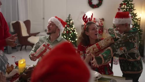 Family Christmas Celebration with Gifts and Hugs