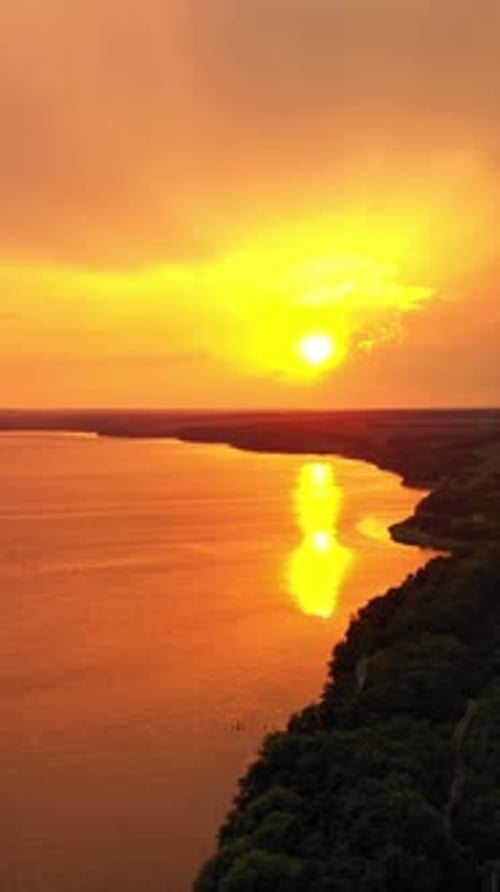 Beautiful river and green scenery in the evening with the setting sun.