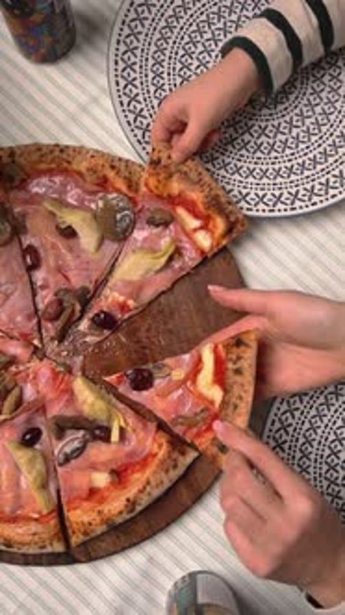 The chef makes delicious pizza in a professional kitchen.