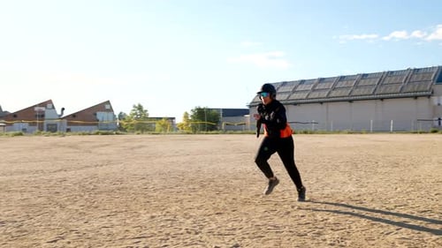 Baseball Player Sliding Into Base During Game
