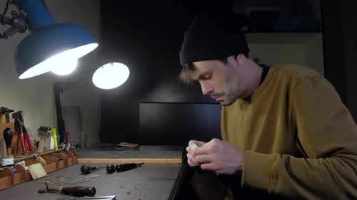 Person Tailor Who Works with Leather in Workplace