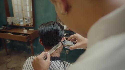 Barber Giving Haircut in a Retro Barbershop