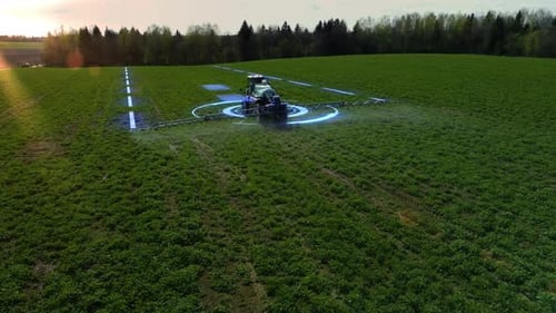 Smart technology in agriculture. Tractor controlled by artificial intelligence treats the ground.