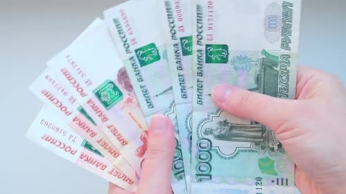 A Closeup of the Fingers of Hand Counting Russian Ruble Banknotes Male Hands Count Russian Money