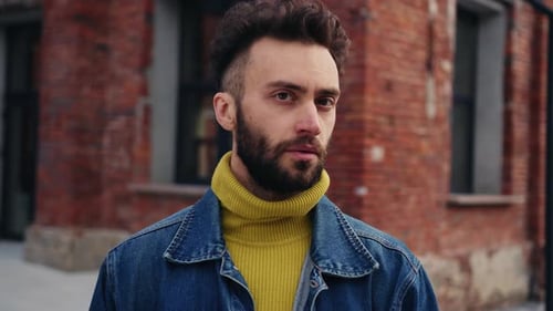 Portrait of Confident Young Handsome Bearded Man Looking Directly at Camera Closeup Footage of Guy